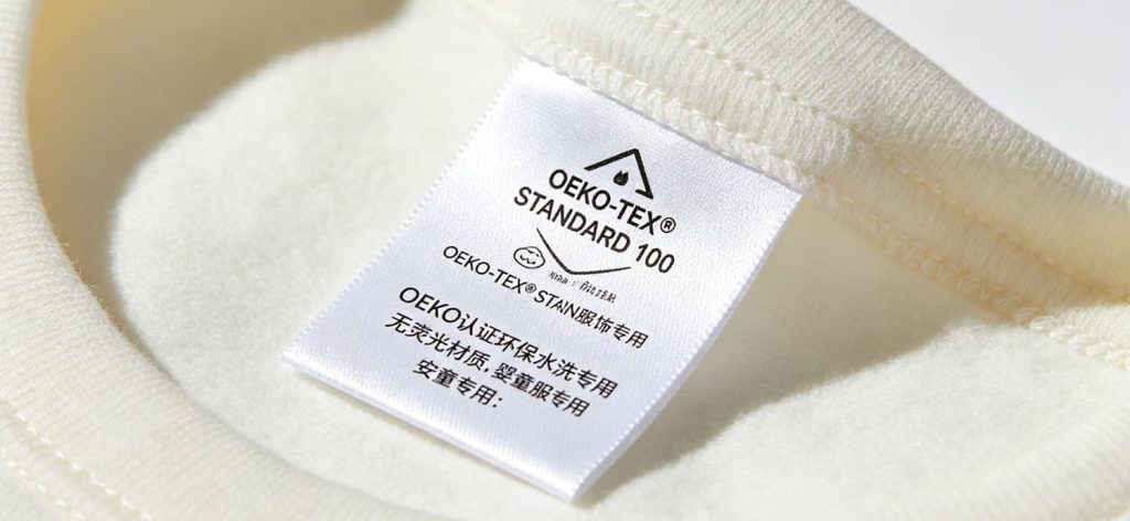 洗水标 (13)s OEKO-TEX 环保水洗标细节特写,无荧光婴童服饰专用合规棉带洗水唛